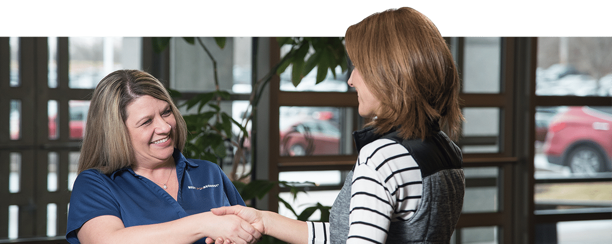 best upon request member shaking woman's hand