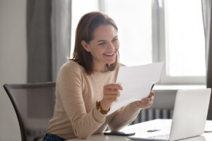 woman at a desk reading