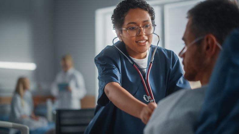 Happy nurse caring for patient