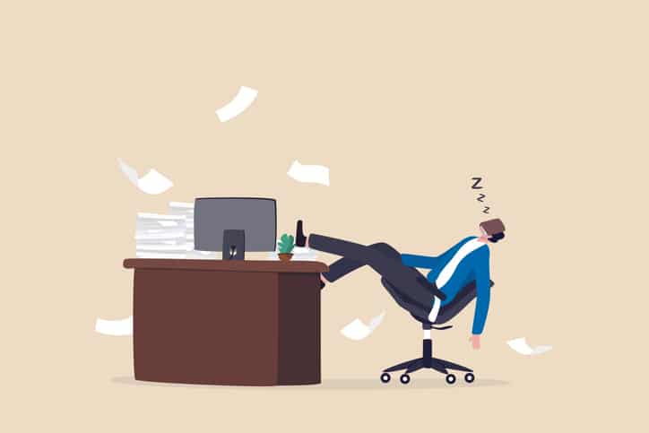 Quiet quitting, lack of work motivation, work boredom or morality, exhaustion or burn out from hard work without recognition concept, unhappy businessman sleeping while working at busy workplace.