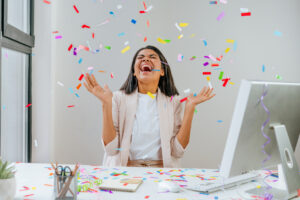 Young business woman having fun at work