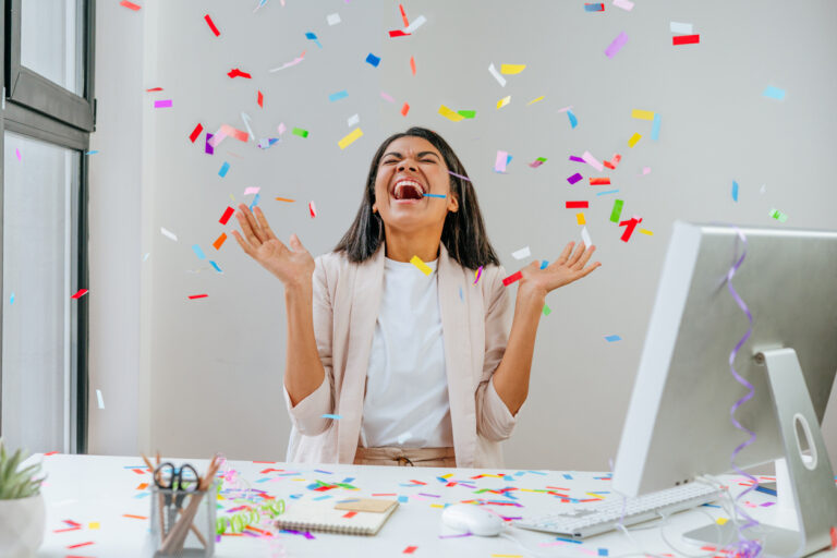 Young business woman having fun at work